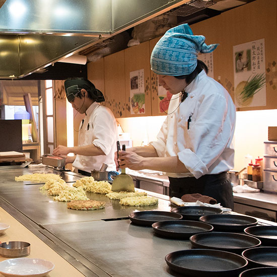 Chefs preparing food in kitchen